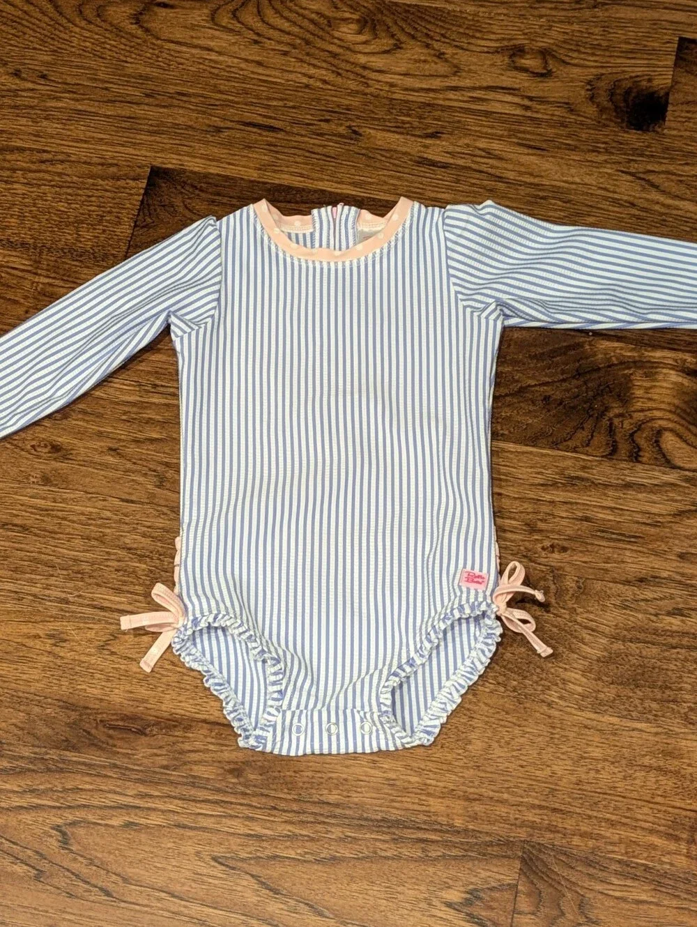 Ruffle Butts Blue and White Striped One-Piece with Pink Trim